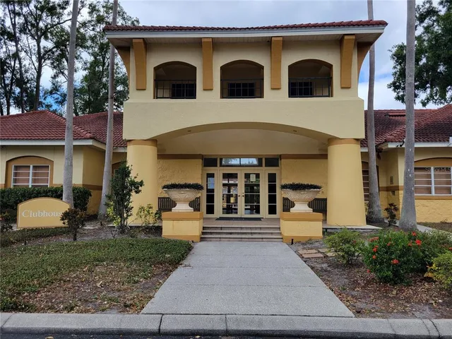 a living room with fireplace furniture and a large window