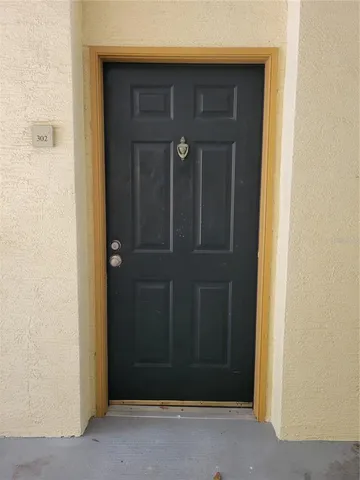 a view of hallway with wooden floor