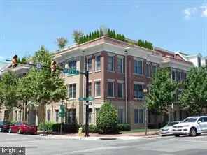 a view of a car parked in front of a building