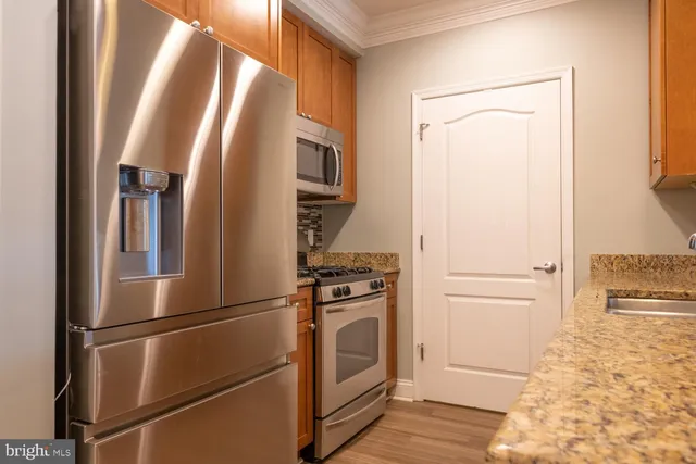 a view of a kitchen from the main door