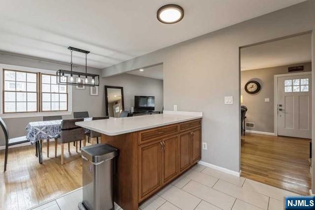 23 Asmus Road Closter, NJ 07624 - Photo 12 of 38 a view of a kitchen with dining table and chairs
