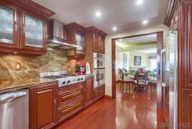 a kitchen with a table and chairs in it