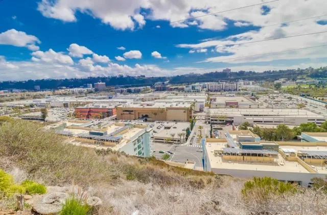 a view of a city with lawn chairs