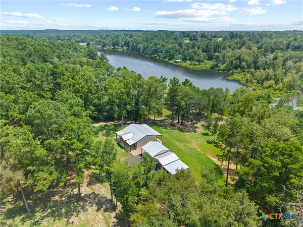 a view of a lake with a yard