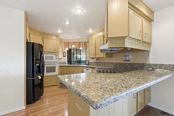 a kitchen with a sink and a stove