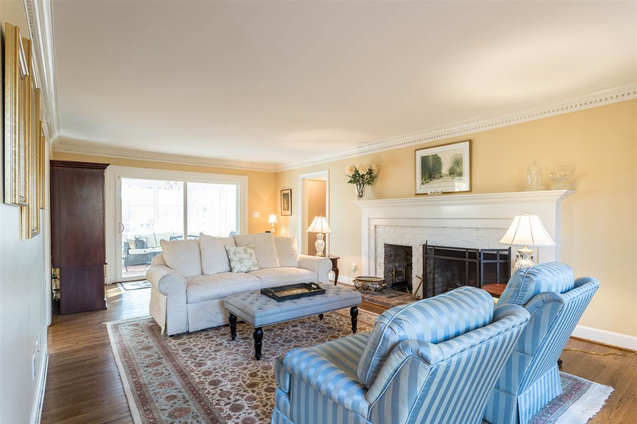 7728 Rainwater Road Raleigh, NC 27615 - Photo 6 of 30 What wonderful living space! Perfect for everyday living and social gatherings. Beautiful hardwood floors( installed by sellers), picturesque painted brick mantel, smooth ceilings and gas fireplace Welcoming Family Room