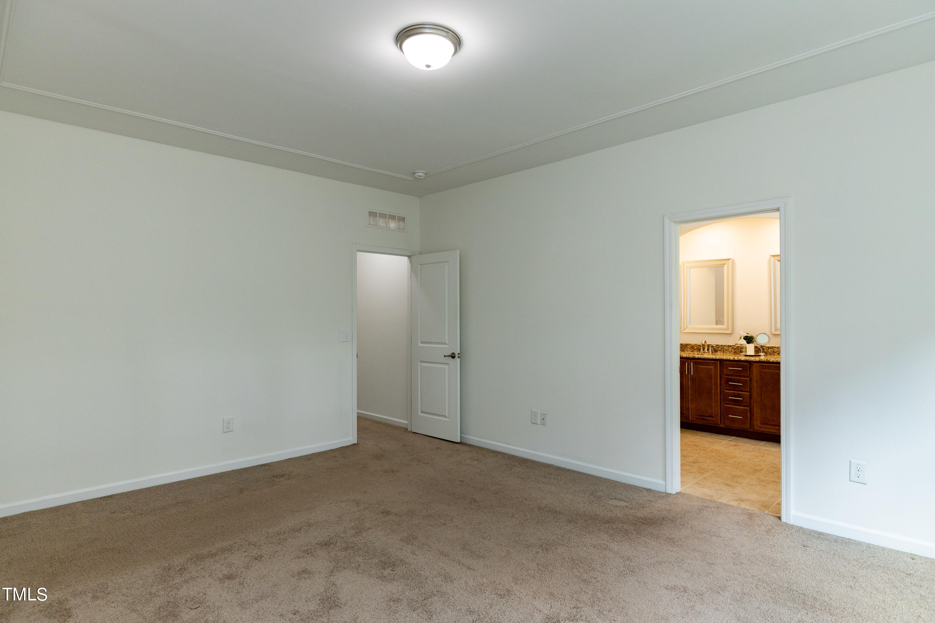 711 Edgewater Ridge Court Apex, NC 27523 - Photo 14 of 29 an empty room with a bathroom