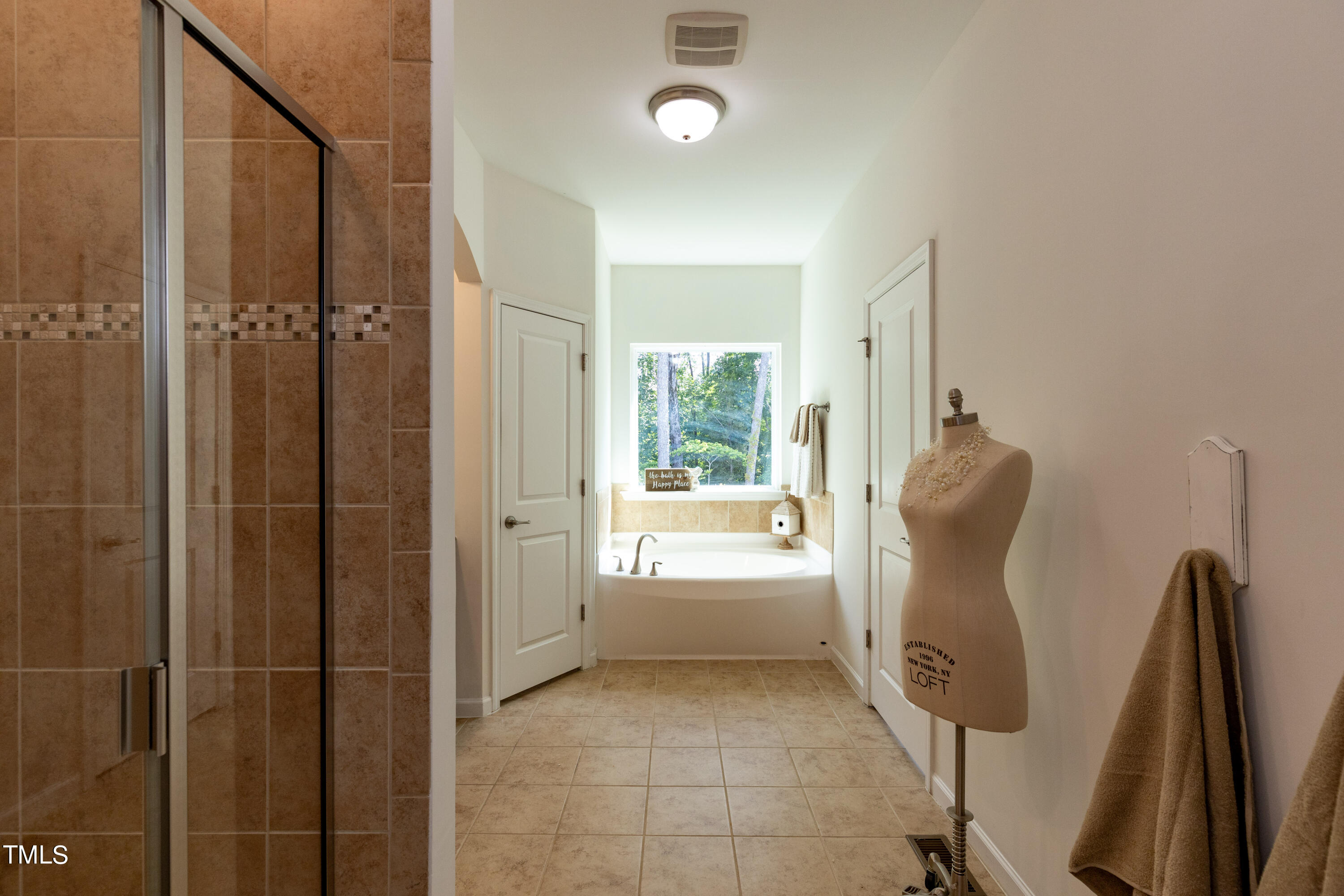 711 Edgewater Ridge Court Apex, NC 27523 - Photo 16 of 29 a bathroom with a shower