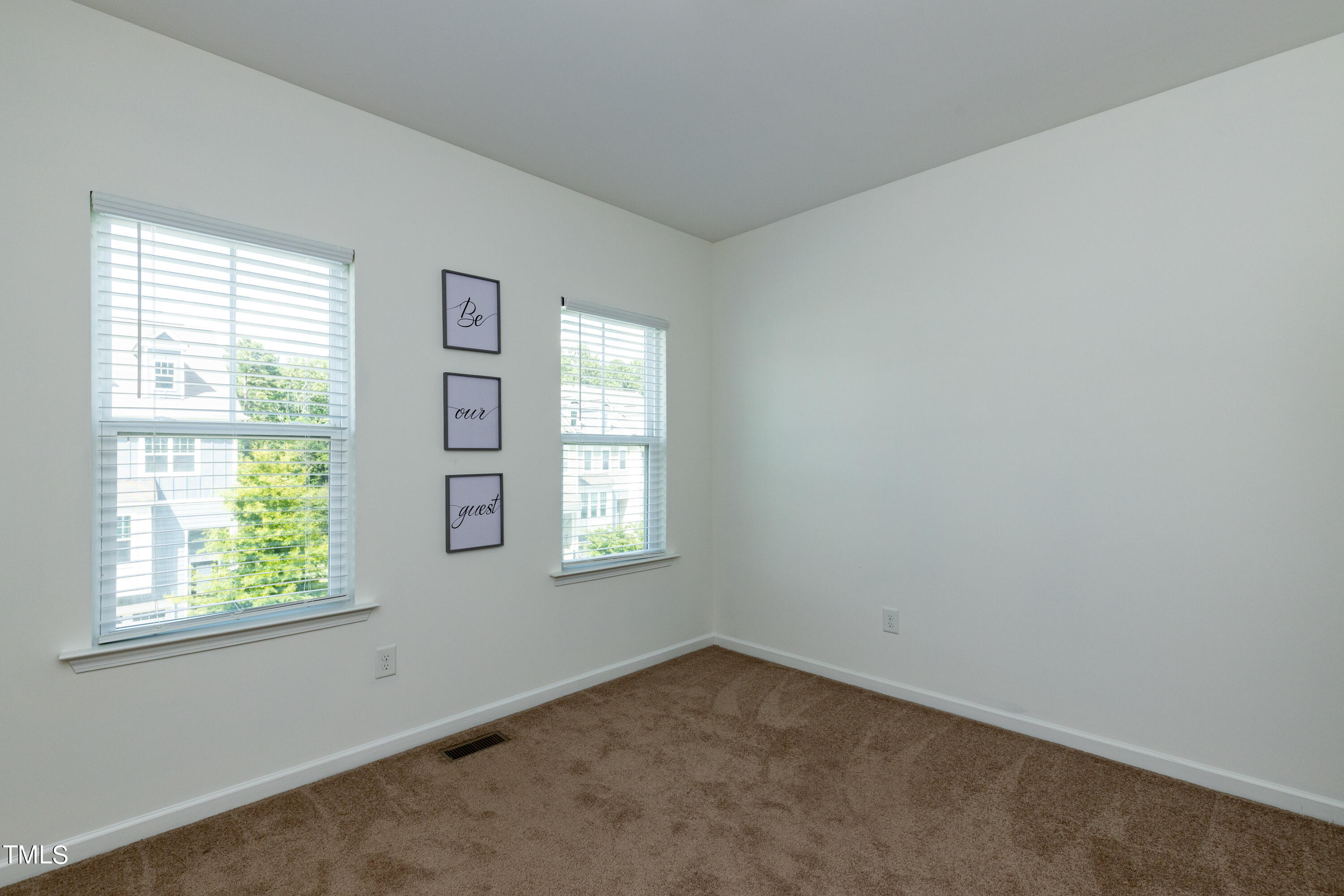 711 Edgewater Ridge Court Apex, NC 27523 - Photo 18 of 29 an empty room with windows