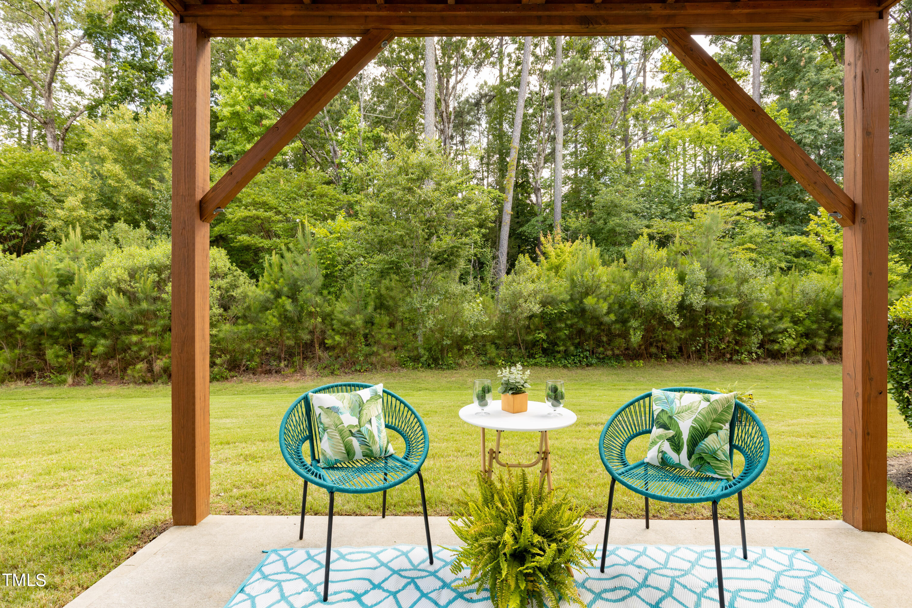711 Edgewater Ridge Court Apex, NC 27523 - Photo 27 of 29 a view of a swimming pool with a backyard and a garden