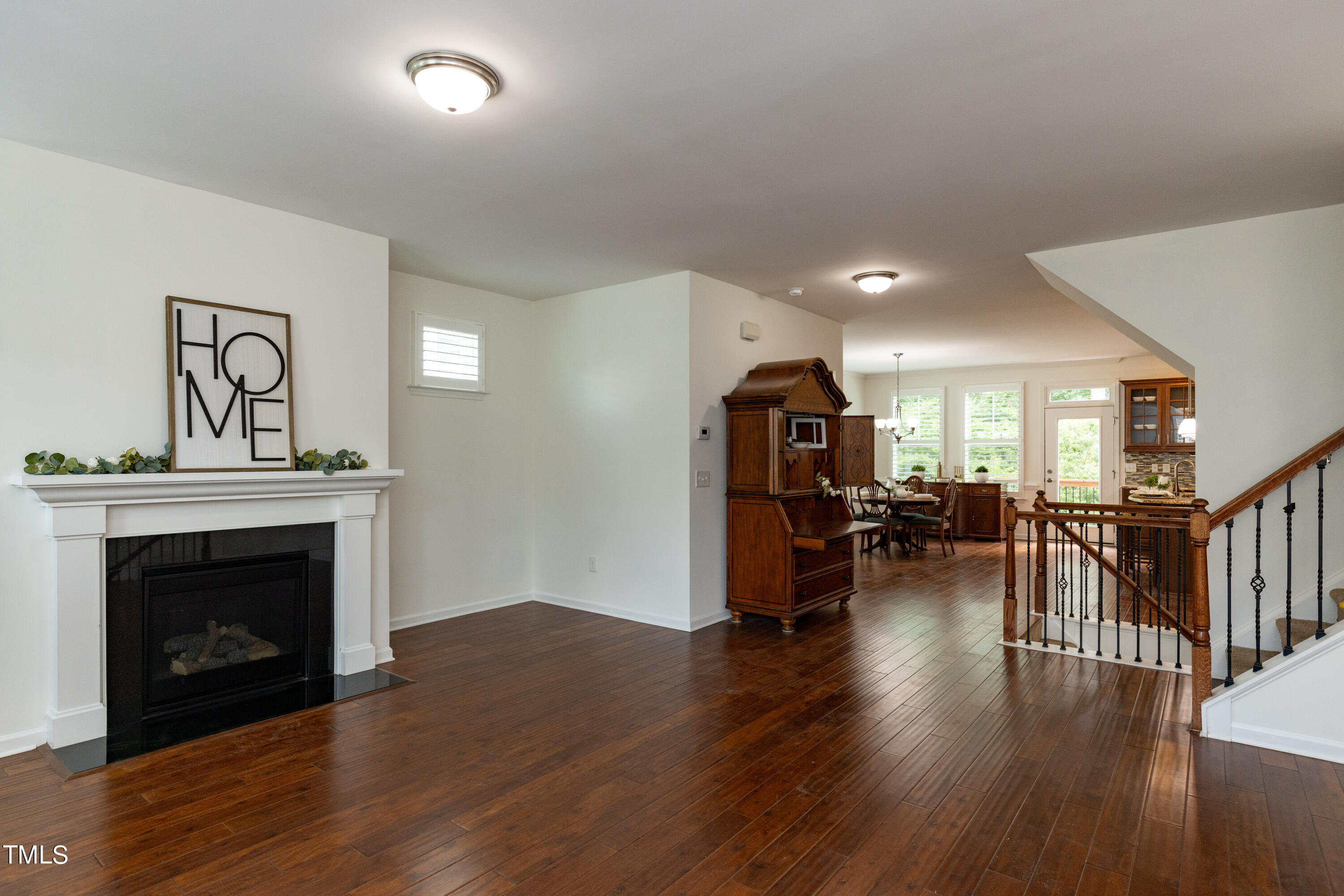 711 Edgewater Ridge Court Apex, NC 27523 - Photo 6 of 29 a view of livingroom with furniture and a fireplace