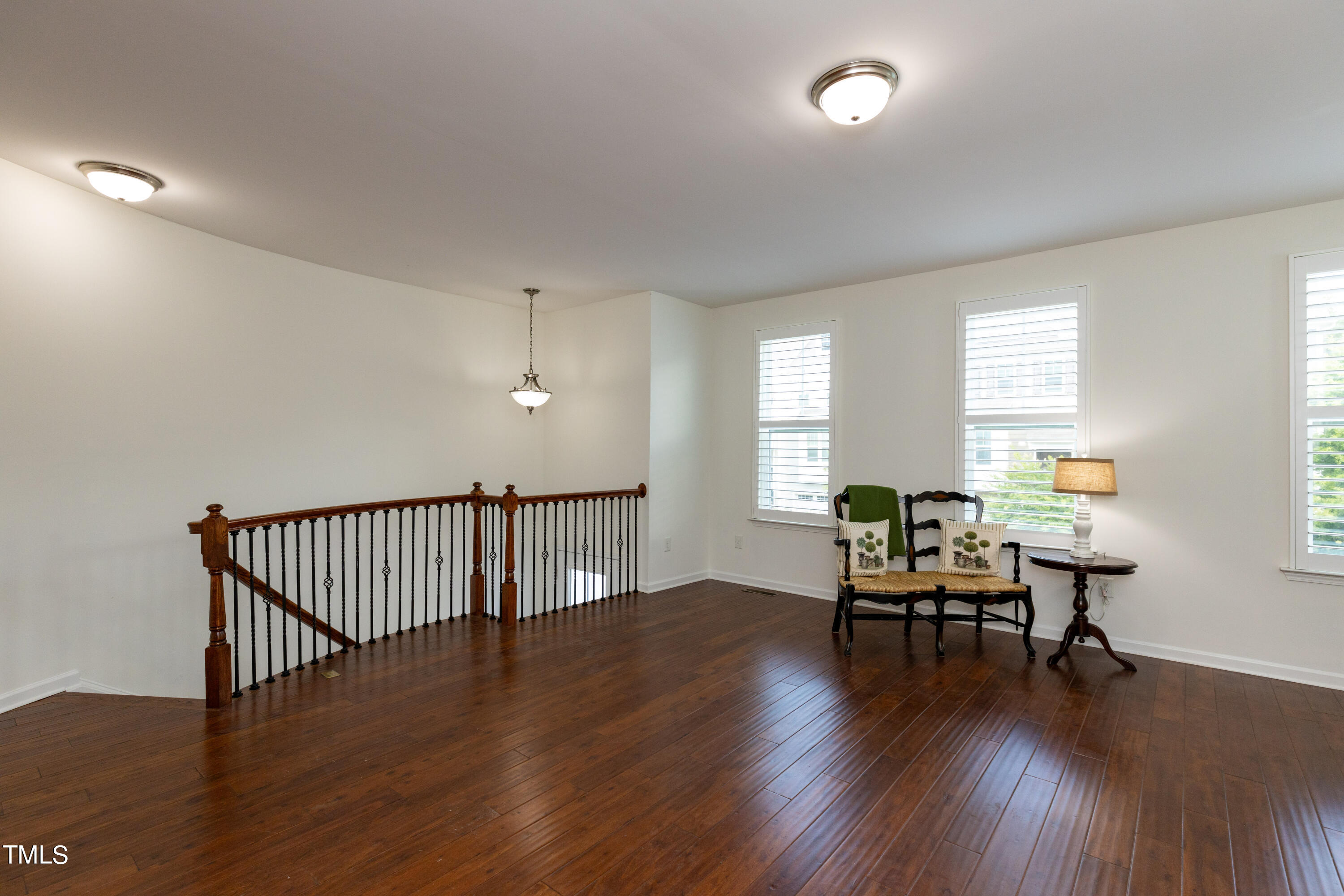711 Edgewater Ridge Court Apex, NC 27523 - Photo 7 of 29 a view of a livingroom with furniture wooden floor and a window
