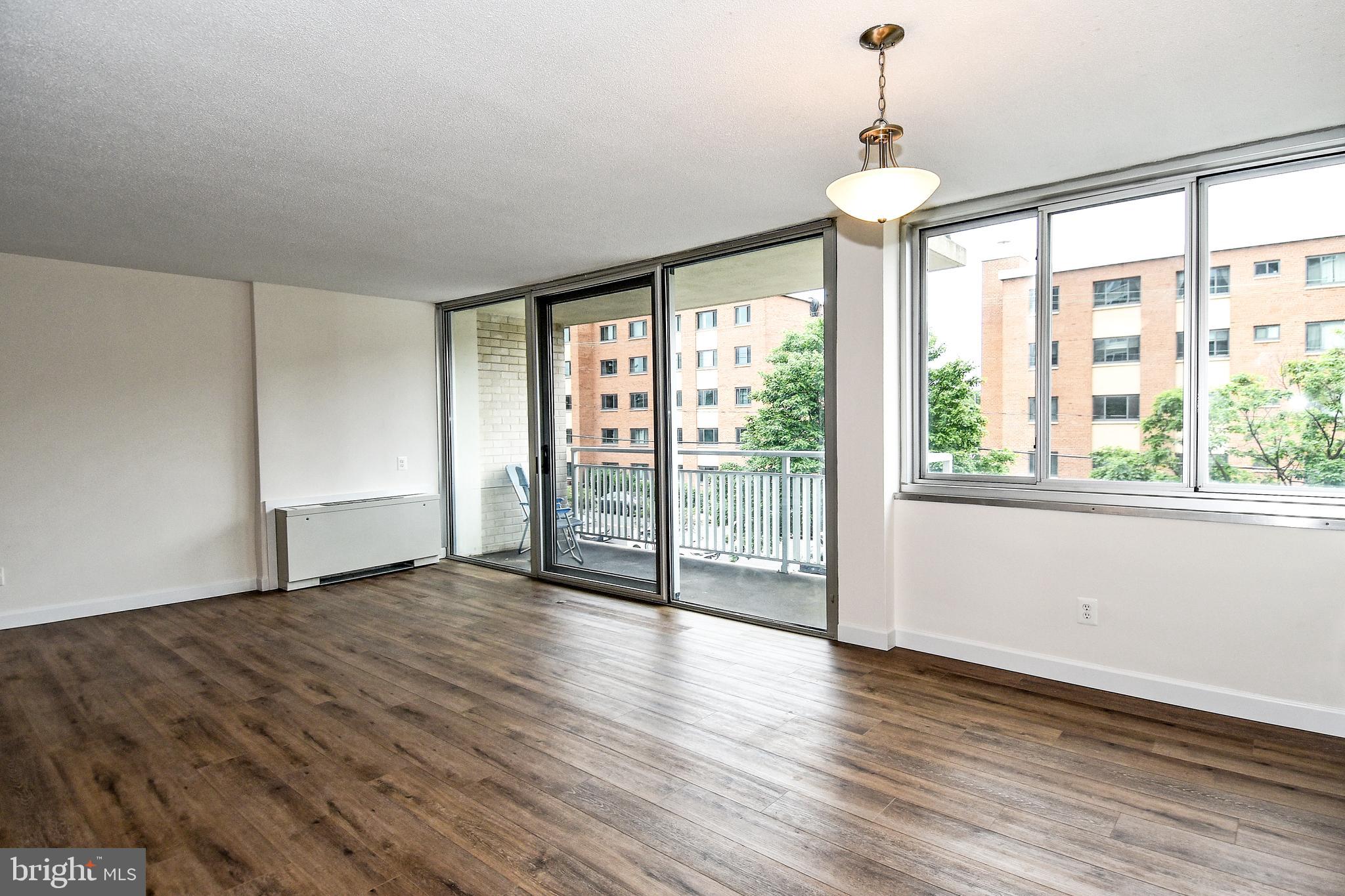 1301 South Arlington Ridge Road, Unit 308 Arlington, VA 22202 - Photo 11 of 45 Living Room with access to the balcony
