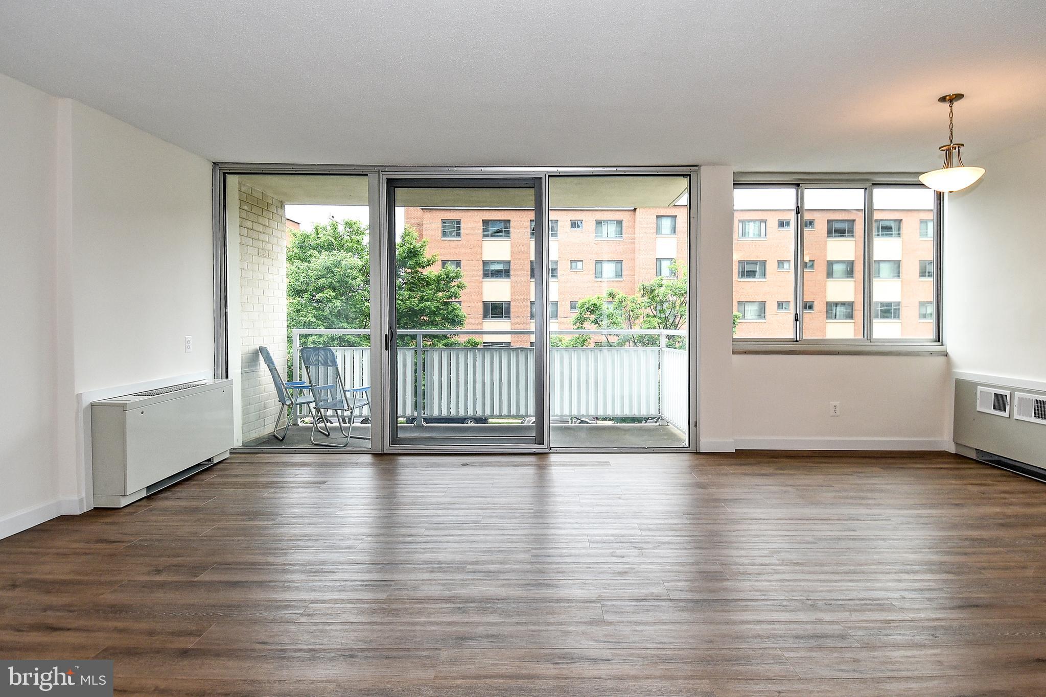 1301 South Arlington Ridge Road, Unit 308 Arlington, VA 22202 - Photo 14 of 45 Living room with balcony access