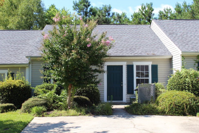 112 Single Tree Lane Aiken, SC 29803 - Photo 1 of 11 a view of a house with potted plants and a table and chairs