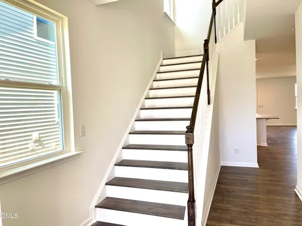 a view of entryway with wooden floor