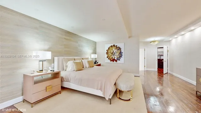 a bedroom with a bed and a lamp on table