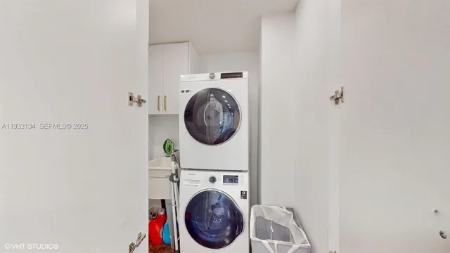 a view of storage and utility room with washer and dryer