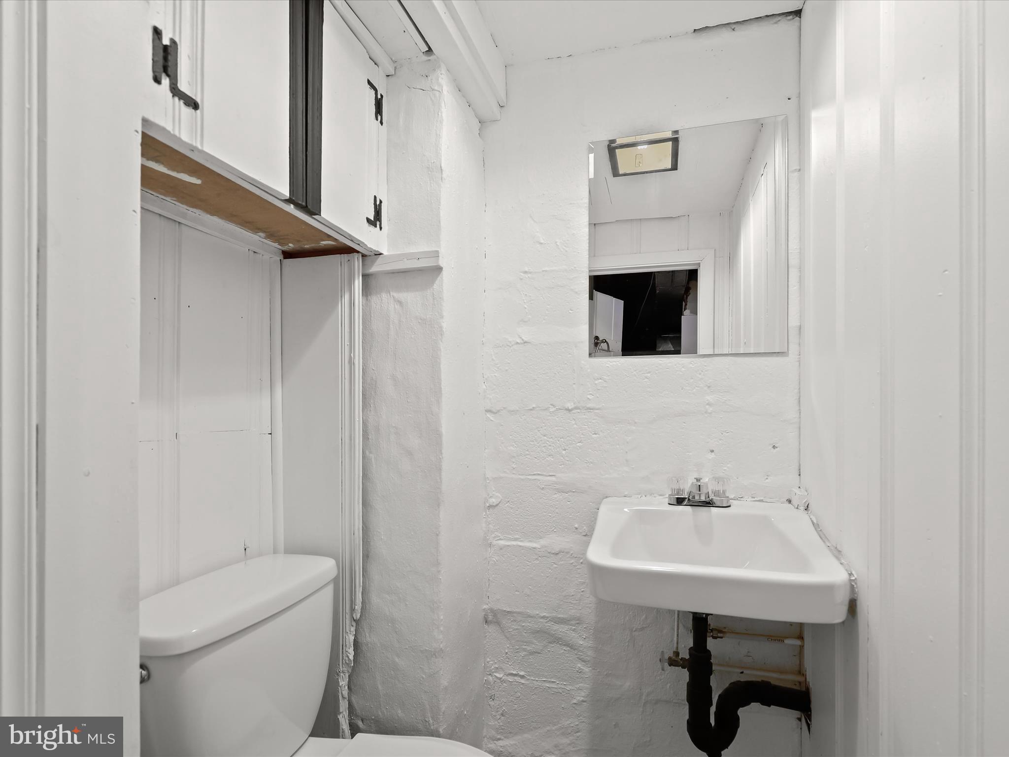 1632 Aberdeen Road Towson, MD 21286 - Photo 29 of 35 a bathroom with a sink toilet and a mirror