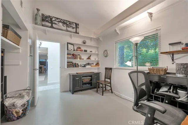 a view of workspace with a window and a fan