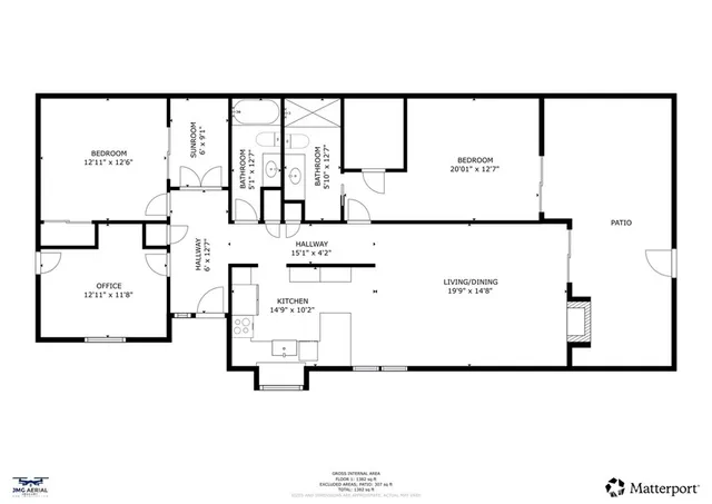 a patio with table and chairs and potted plants