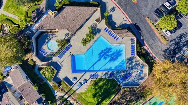 a street sign on a sidewalk next to a road