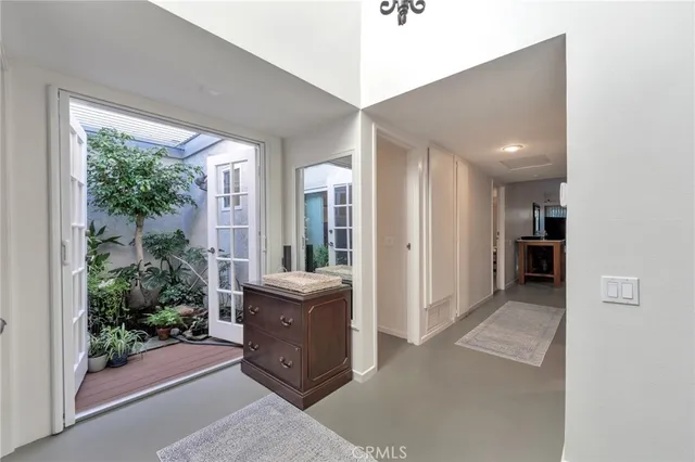 a bedroom with a bed dresser and a window