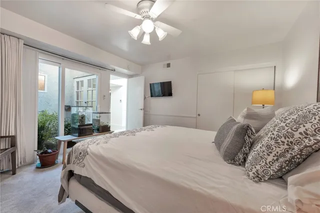 a bed sitting in a bedroom and table