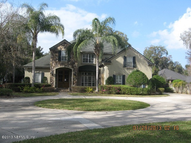 11860 Mandarin Road Jacksonville, FL 32223 - Photo 1 of 43 a front view of house with yard and green space
