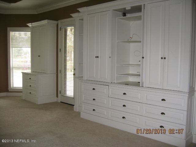 11860 Mandarin Road Jacksonville, FL 32223 - Photo 15 of 43 a view of an empty room with cabinet and mirror