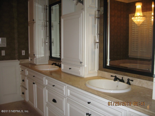 11860 Mandarin Road Jacksonville, FL 32223 - Photo 18 of 43 a bathroom with a sink and a mirror