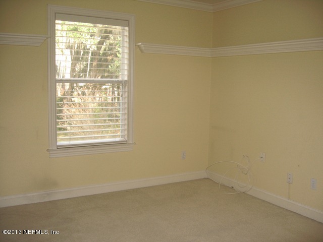 11860 Mandarin Road Jacksonville, FL 32223 - Photo 20 of 43 an empty room with a window