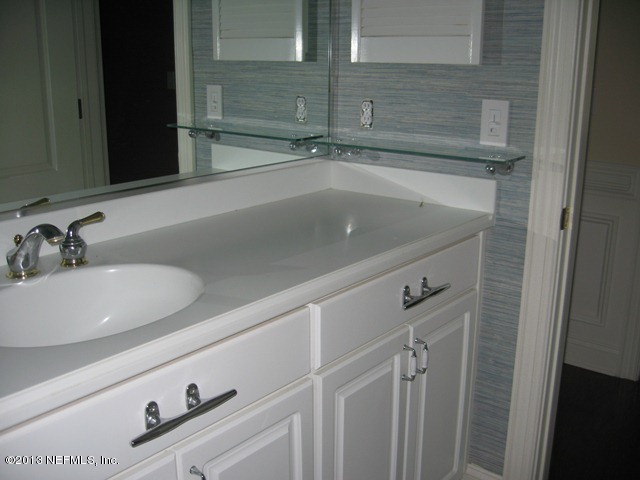 11860 Mandarin Road Jacksonville, FL 32223 - Photo 24 of 43 a bathroom with a sink and a mirror