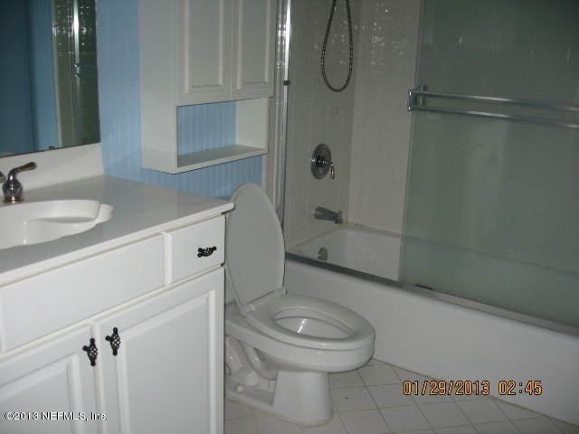 11860 Mandarin Road Jacksonville, FL 32223 - Photo 25 of 43 a bathroom with a toilet a sink and shower