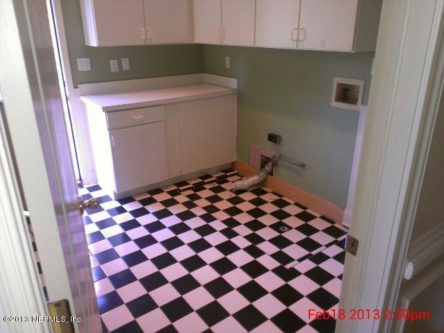 11860 Mandarin Road Jacksonville, FL 32223 - Photo 26 of 43 a room with a black white checkered floor