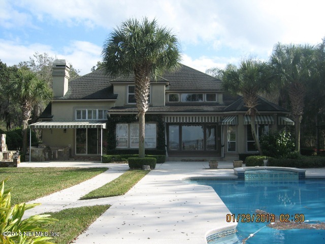 11860 Mandarin Road Jacksonville, FL 32223 - Photo 27 of 43 a front view of house with yard and green space