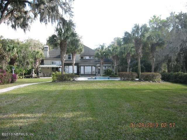 11860 Mandarin Road Jacksonville, FL 32223 - Photo 28 of 43 a view of a house with a yard