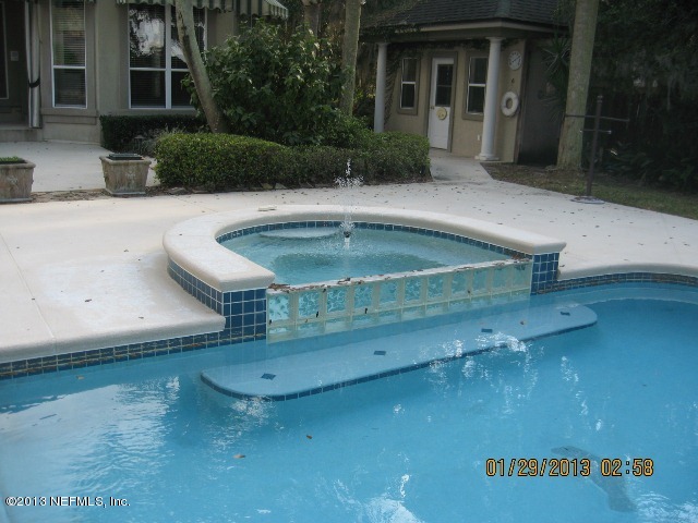 11860 Mandarin Road Jacksonville, FL 32223 - Photo 29 of 43 a view of a house with a patio