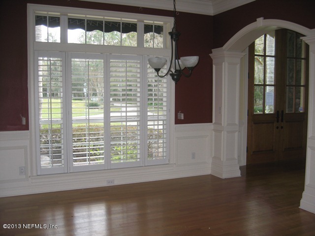 11860 Mandarin Road Jacksonville, FL 32223 - Photo 3 of 43 a front view of a house with large windows
