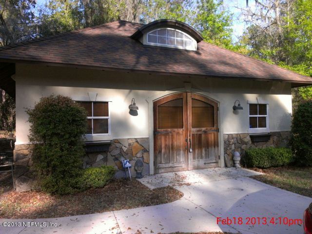 11860 Mandarin Road Jacksonville, FL 32223 - Photo 34 of 43 a front view of a house with garden