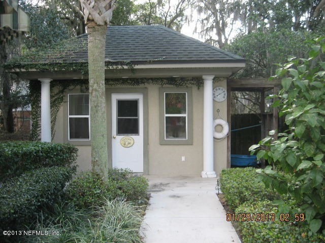 11860 Mandarin Road Jacksonville, FL 32223 - Photo 37 of 43 a front view of a house with a yard