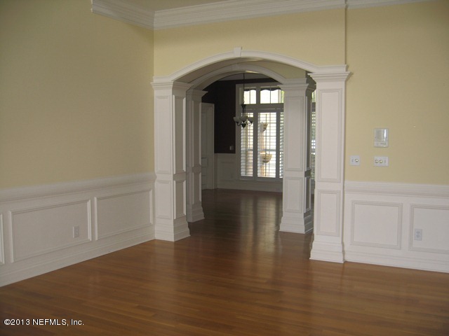 11860 Mandarin Road Jacksonville, FL 32223 - Photo 6 of 43 a view of empty room with wooden floor and fan