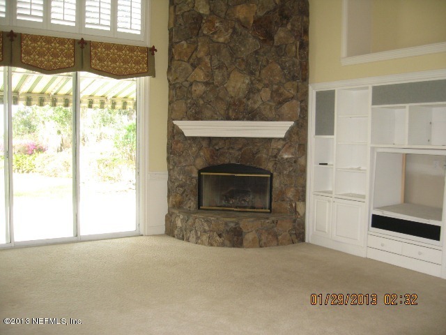 11860 Mandarin Road Jacksonville, FL 32223 - Photo 7 of 43 a view of empty room with a fireplace