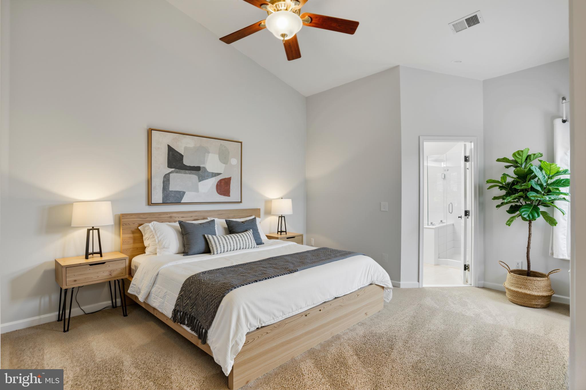 20381 Farmgate Terrace Ashburn, VA 20147 - Photo 14 of 31 a bedroom with a bed and a chandelier