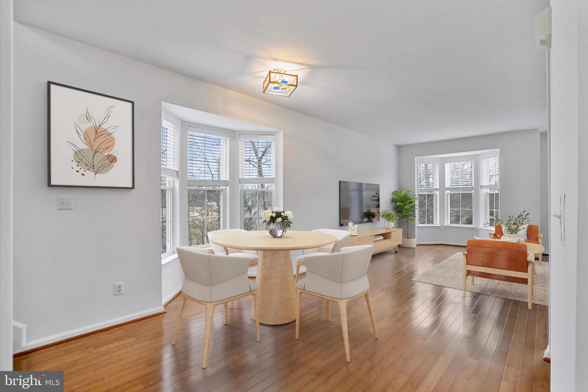 20381 Farmgate Terrace Ashburn, VA 20147 - Photo 4 of 31 a dining room with furniture and wooden floor