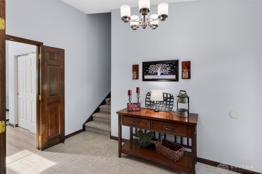 2165 Stewart Road Xenia, OH 45385 - Photo 3 of 59 This inviting entryway showcases a functional design with natural light and easy access to the upper level.