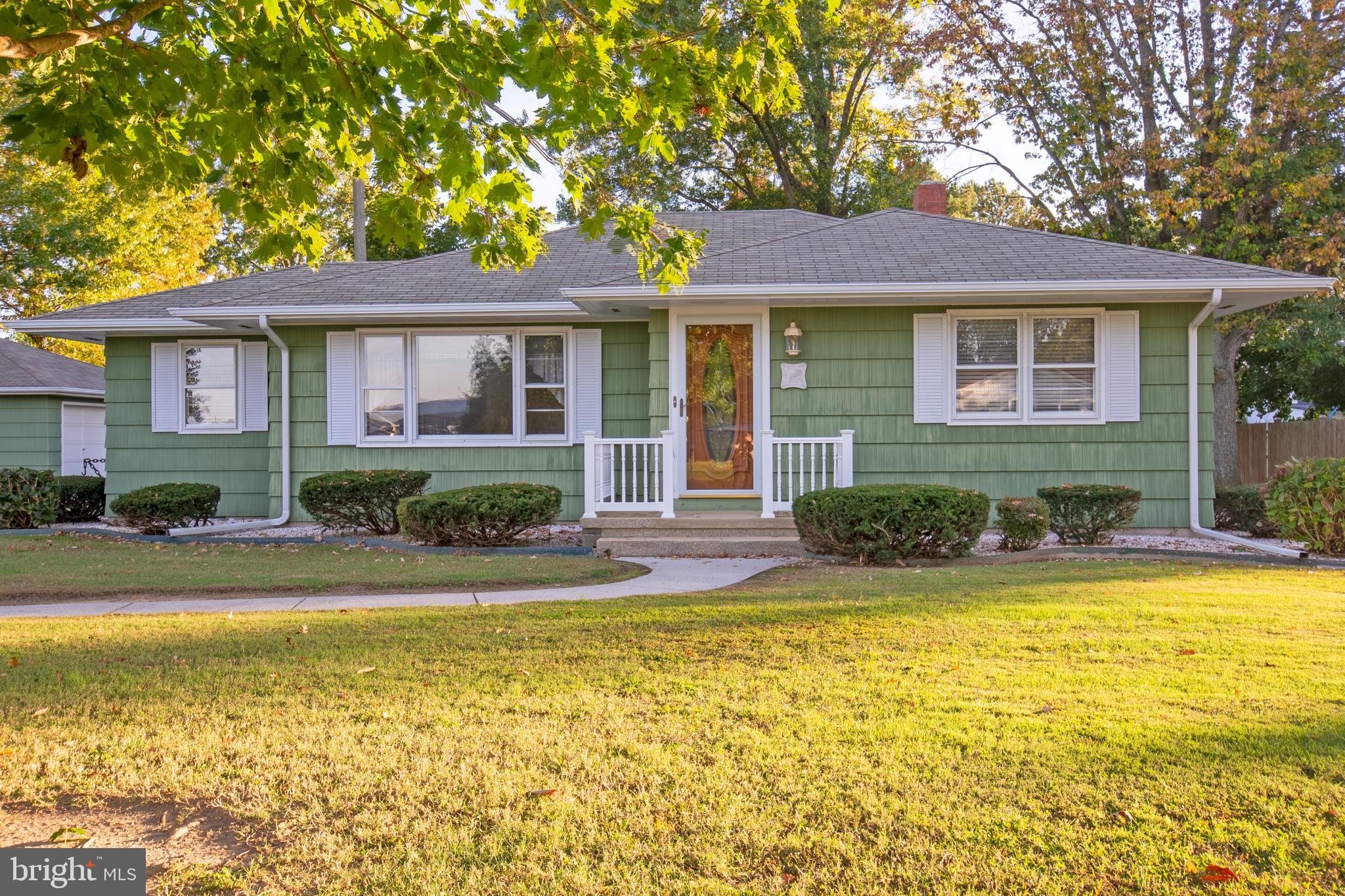 a view of a house with swimming pool and a chairs