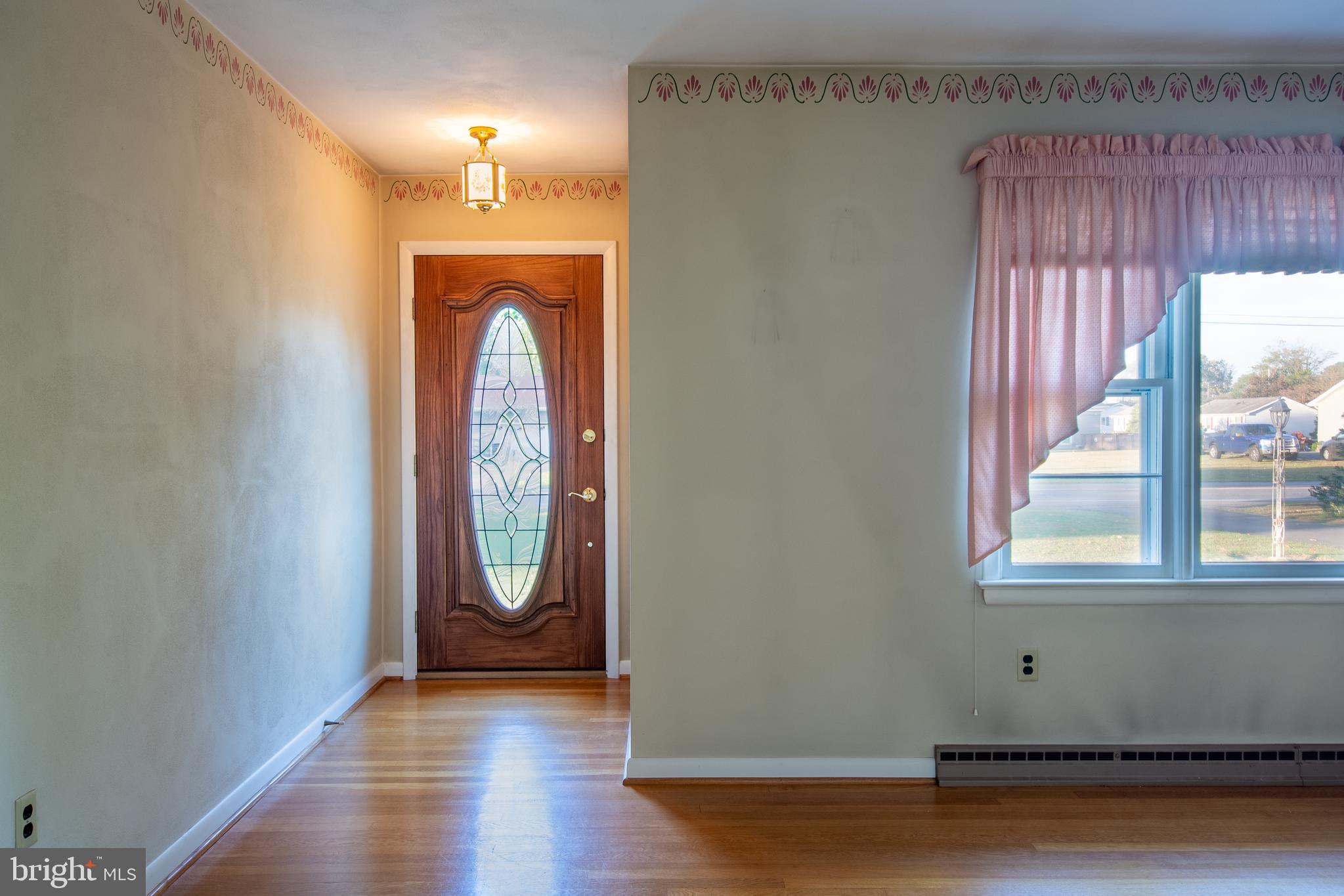 18532 Johnson Road Lincoln, DE 19960 - Photo 23 of 55 an empty room with wooden floor and a window