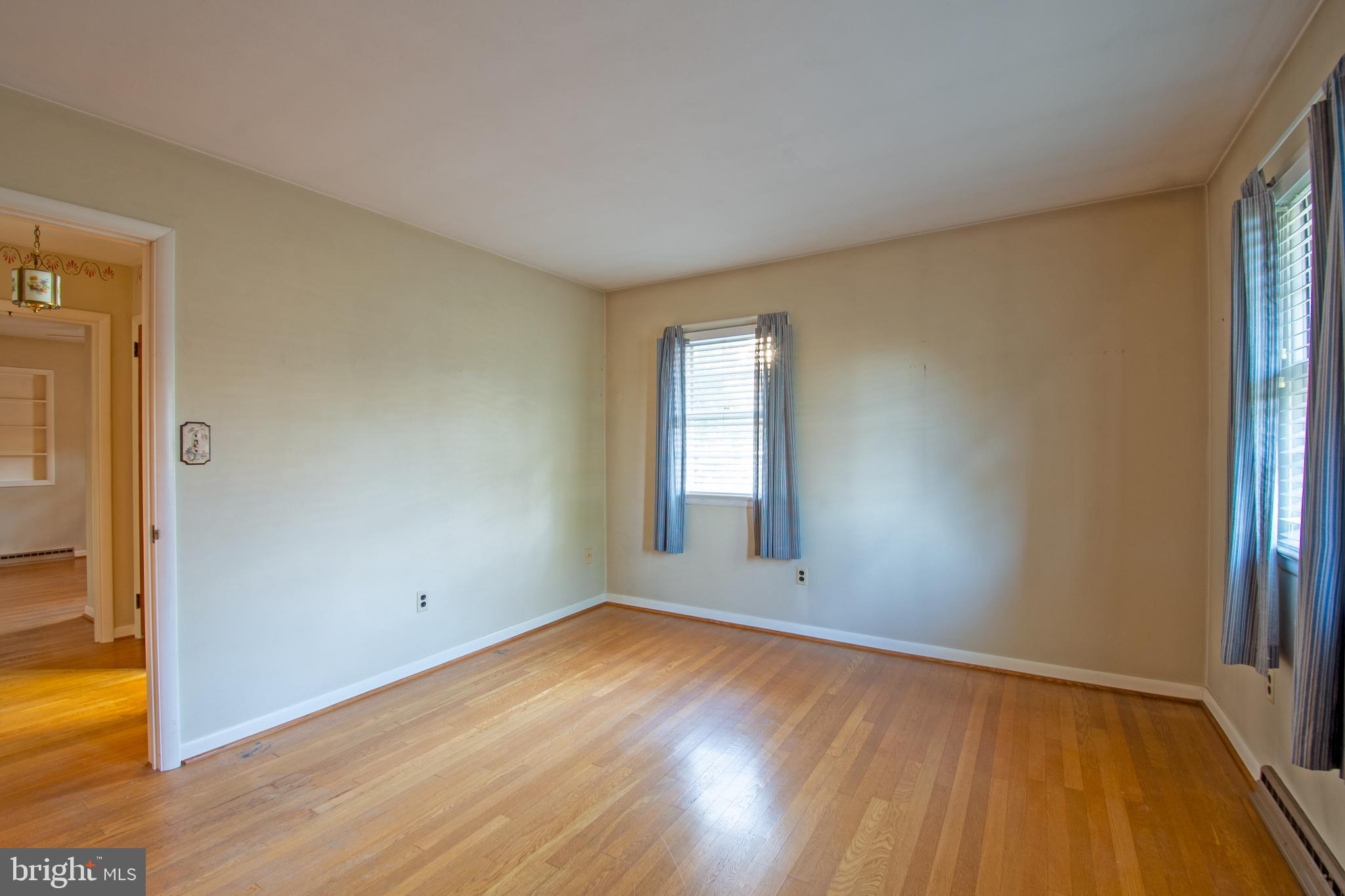 18532 Johnson Road Lincoln, DE 19960 - Photo 28 of 55 an empty room with wooden floor and windows