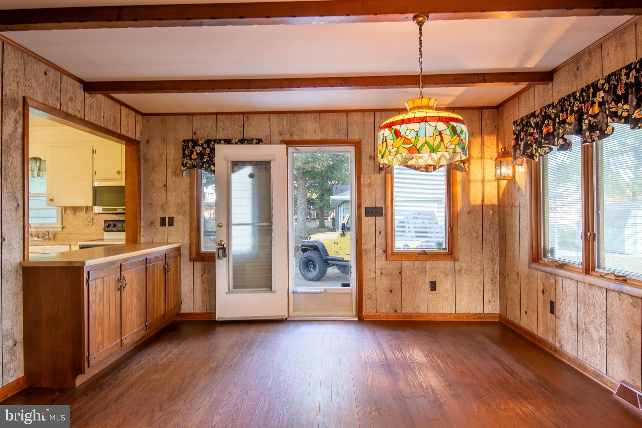 18532 Johnson Road Lincoln, DE 19960 - Photo 33 of 55 a view of a hallway with wooden floor and windows